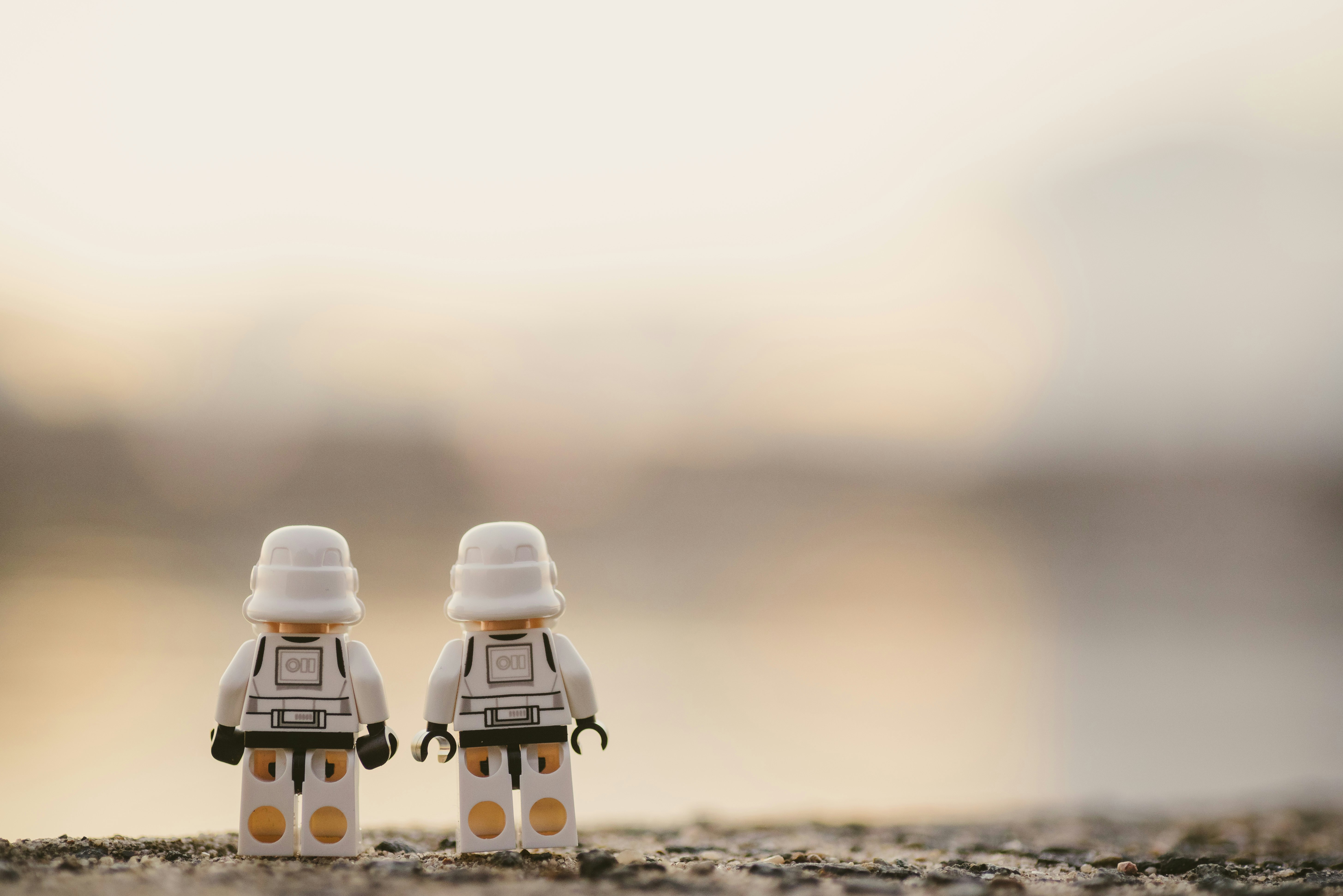 selective focus photography of two white Lego minifigures